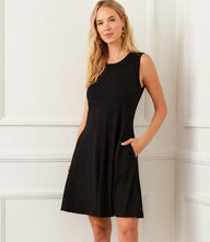 Sleeveless fit and flare dress with scoop neck, side pockets, and center seam detailing in rayon spandex jersey