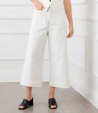 Stripe cropped wide-leg pants in uneven stripe stretch twill with front and back pockets and button-zipper closure.