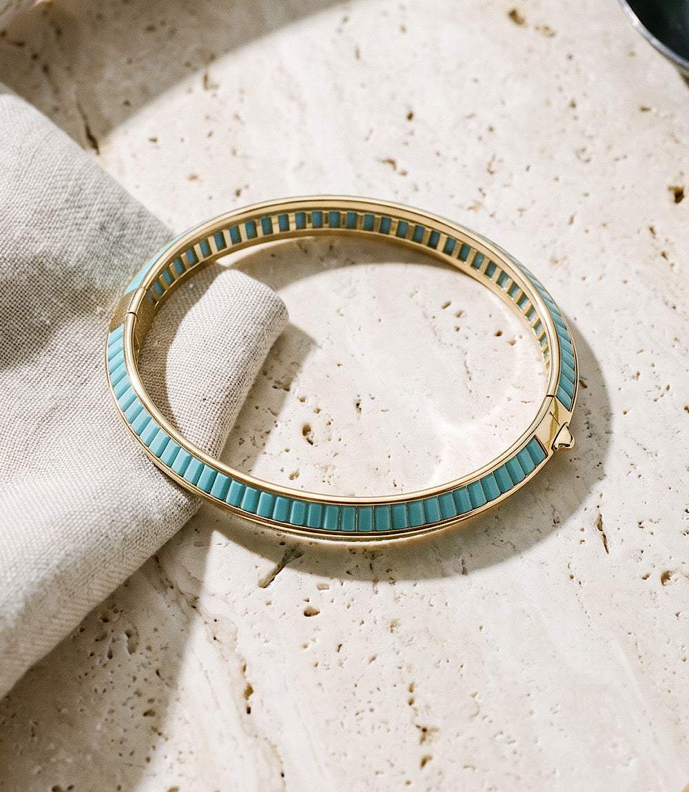 Gold-plated turquoise beaded bangle with double-edge design and trigger clasp