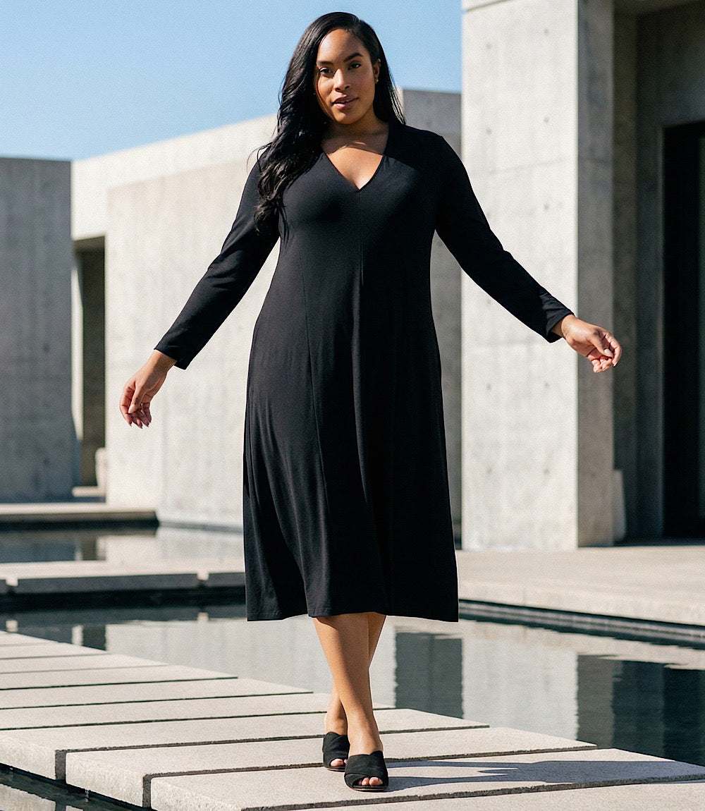 Plus Size Kate V-Neck Midi Travel Dress with long sleeves and subtle flare in black jersey fabric