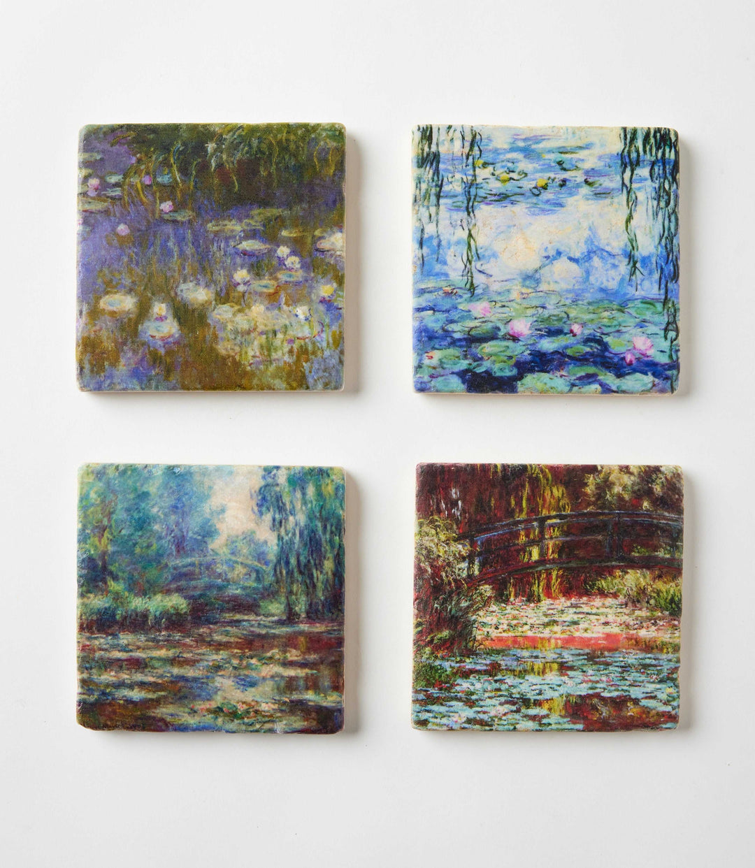 Set of 4 Monet Tile Marble Coasters with Impressionist water lily artwork on tumbled marble squares.