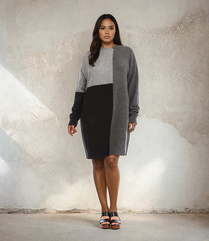 Plus size colorblock sweater dress with mock neck and drop shoulder sleeves in black and gray.