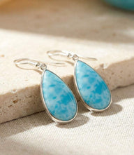 Larimar teardrop earrings with turquoise stones and silver plated hooks