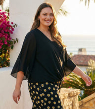 Plus size bracelet sleeve drape front crossover top with flare sleeves and relaxed fit