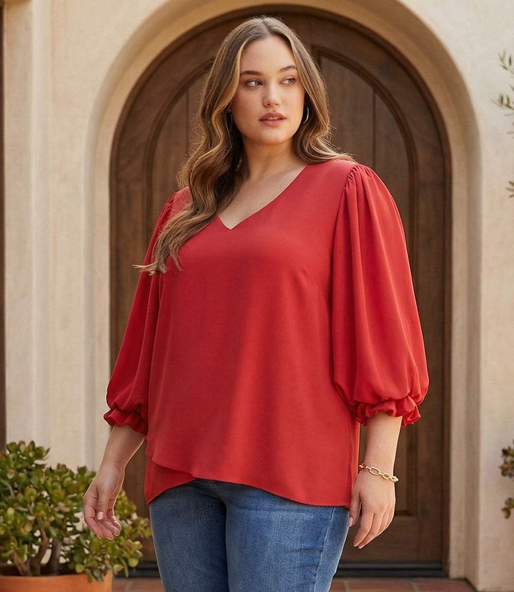 Plus size layered sleeve asymmetric V-neck top with bishop sleeves and asymmetrical hem in lightweight woven fabric