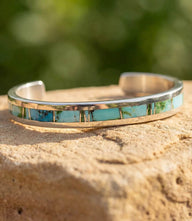 Sterling silver cuff bracelet with turquoise inlay and polished band
