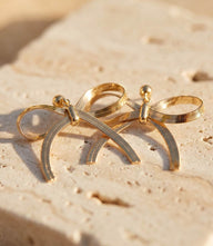 Gold-tone 16K gold plated bow charm earrings with straight post back and delicate feminine design