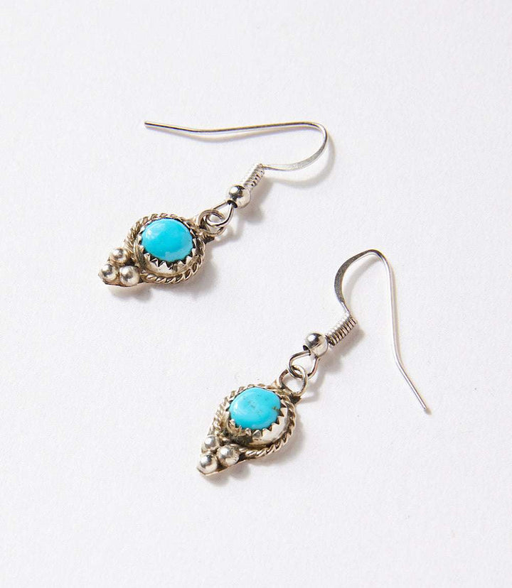 Golden Hill turquoise drop earrings with sterling silver setting and intricate details