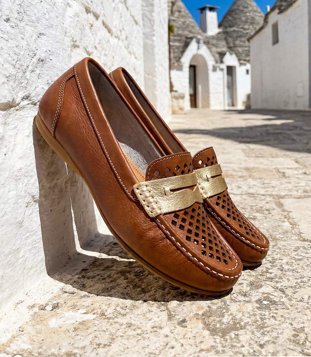 Charleston Shoe Co. Peggy Loafers in ivory with laser-cut pattern and gold detailing, slip-on design