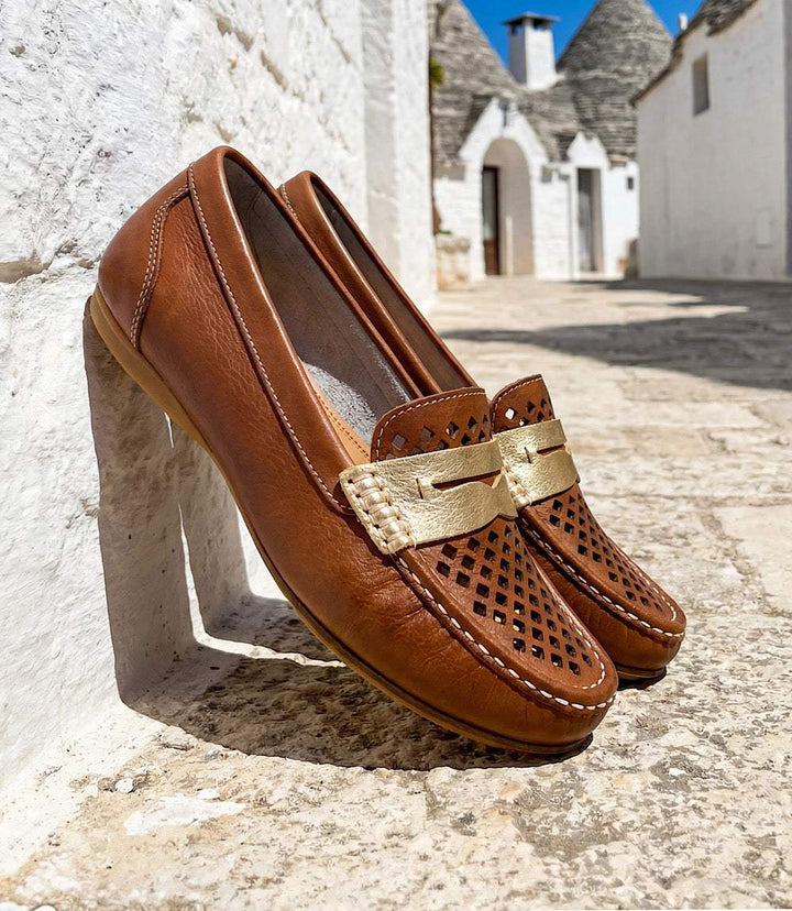 Charleston Shoe Co. Peggy Loafers in ivory with laser-cut pattern and gold detailing, slip-on design