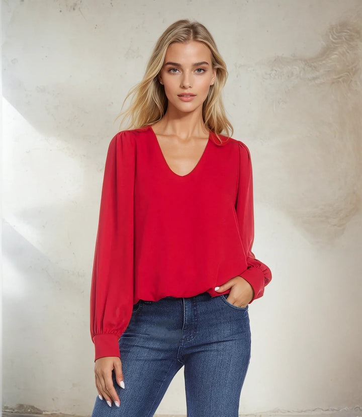 Red Puff Sleeve V-Neck Top with buttoned cuffs and elastic hem worn by model