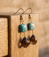 Mixed turquoise gemstone drop earrings with marbled turquoise and faceted brown teardrop gems in gold-tone setting