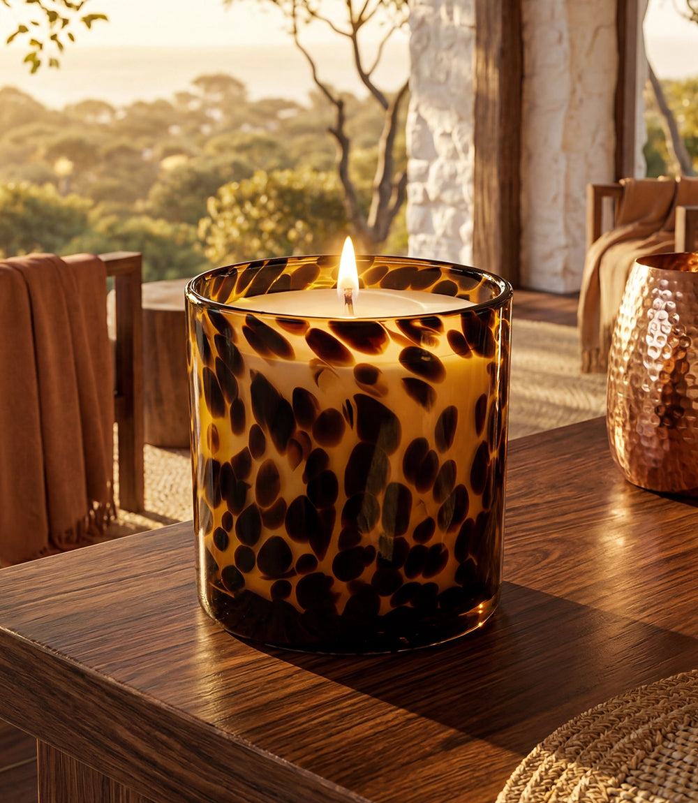 Fig and Oak Tortoise Candle in amber tortoise-patterned glass with layered fig, oak, and vanilla scent