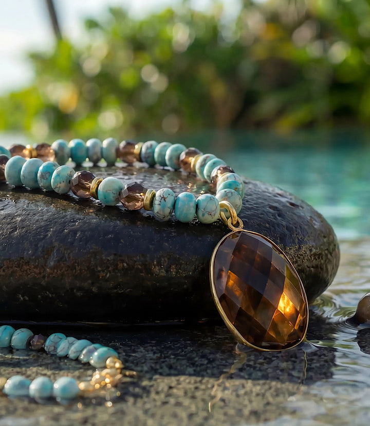 Gemstone pendant necklace with turquoise beads and gold-plated brass setting