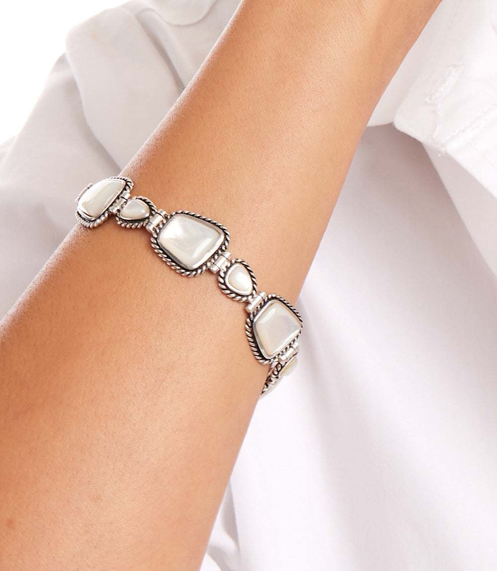 Mother of Pearl toggle bracelet featuring sterling silver and genuine mother of pearl stones on wrist
