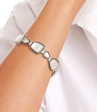 Mother of Pearl toggle bracelet featuring sterling silver and genuine mother of pearl stones on wrist
