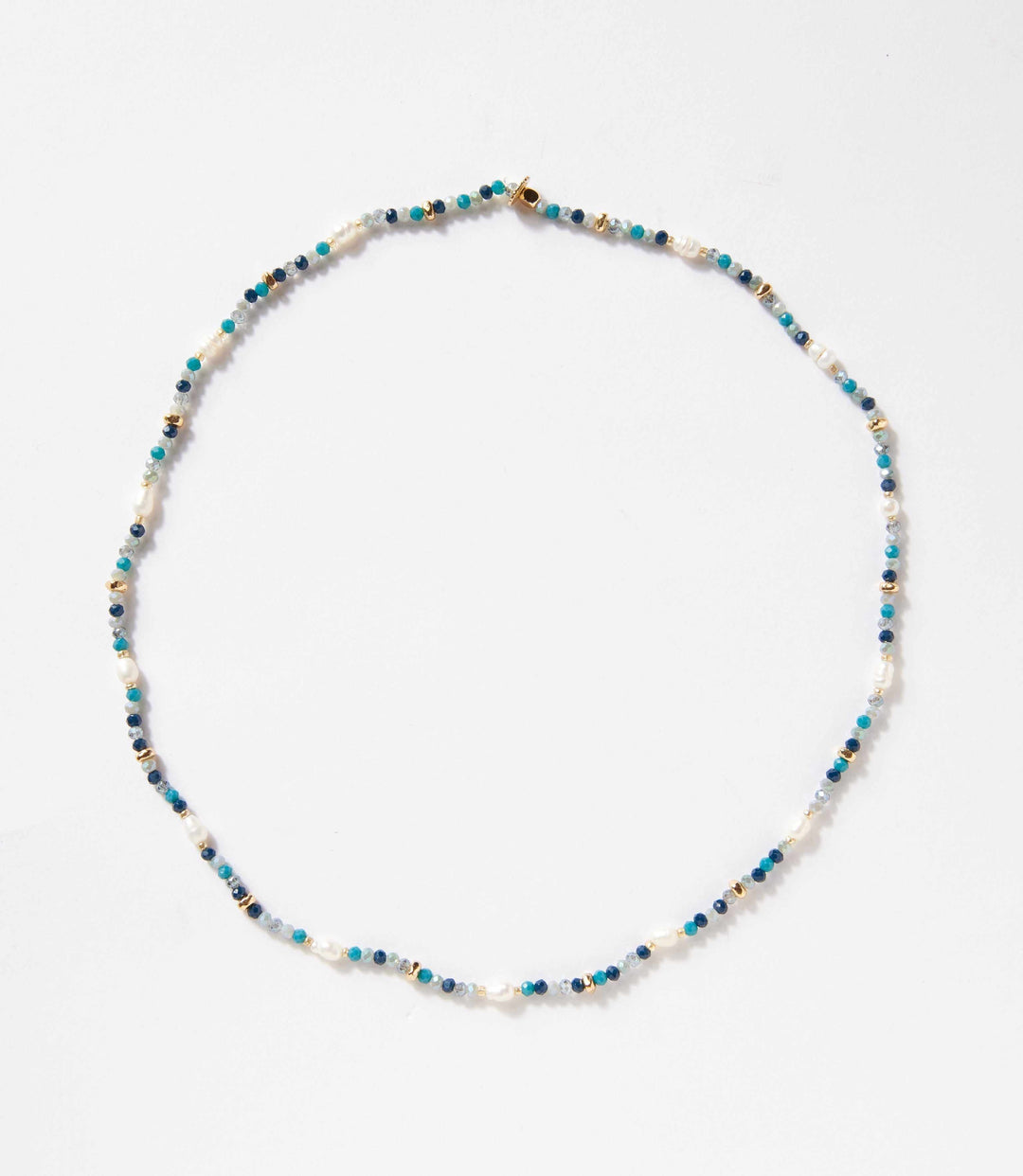 Beaded gemstone and pearl stretch bracelet with mixed blue and white beads on a stretch band