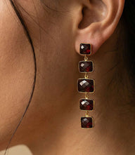 Five Drop Gemstone Earrings with burgundy synthetic garnet and gold-plated settings in a linear design