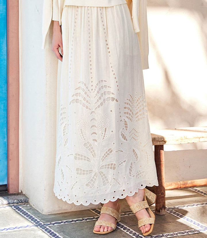 Cream cutout embroidery midi skirt with scalloped hem and elastic waistband featuring side pockets