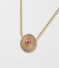 Gemstone disc necklace with pink cubic zirconia and red center stone on 14K gold plated brass chain