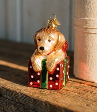 Golden Puppy Surprise Glass Ornament