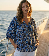 Plus size puff sleeve peasant top in blue floral morning glory crepe print with scoop neck and button front closure