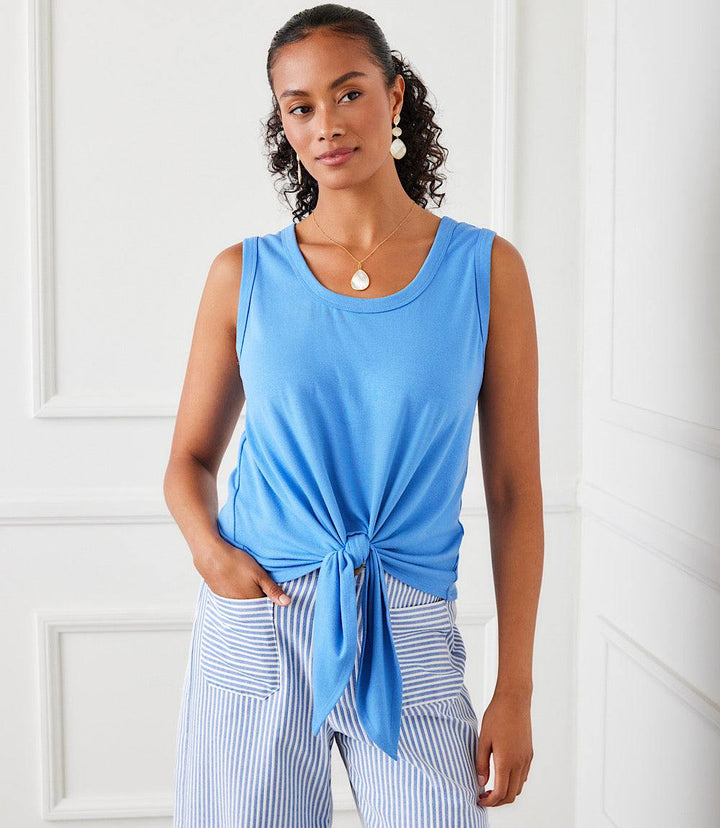 Woman wearing blue tie front tank top made of hemp organic cotton blend with scoop neck and fitted waist