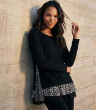Layered Contrast Leopard Sweater with black and white leopard print hem and relaxed silhouette