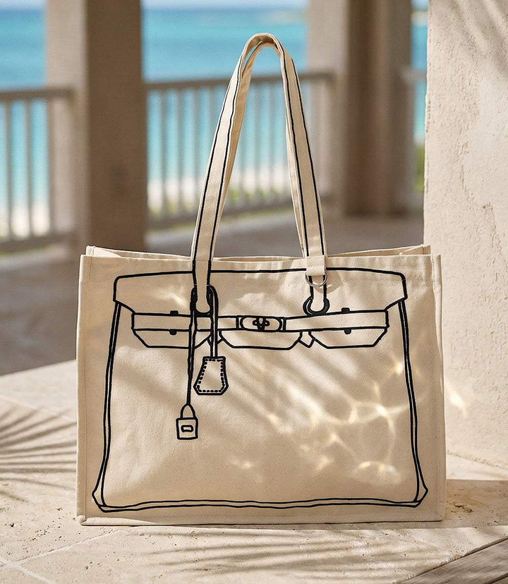 Natural cotton canvas tote bag with sketch motif and magnetic snap closure