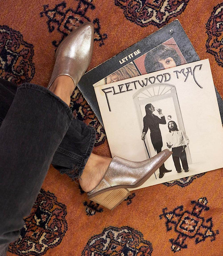 Seychelles Morning Joe pewter suede mule boots with pointed toe and stacked heel on patterned rug with vinyl records