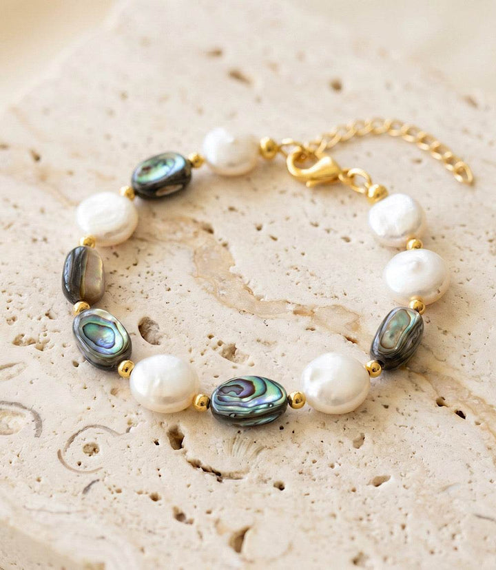 Abalone and pearl bracelet with iridescent abalone and luminous freshwater pearls on gold plated brass