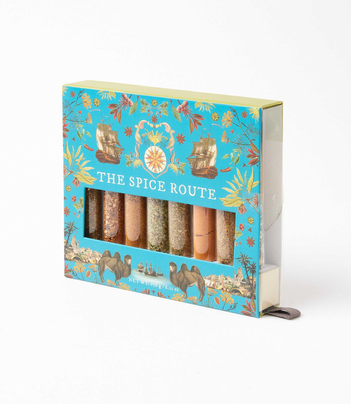 The Spice Route Gift Set with 8 exotic spice blends in reusable glass tubes, vibrant packaging with historic spice route design