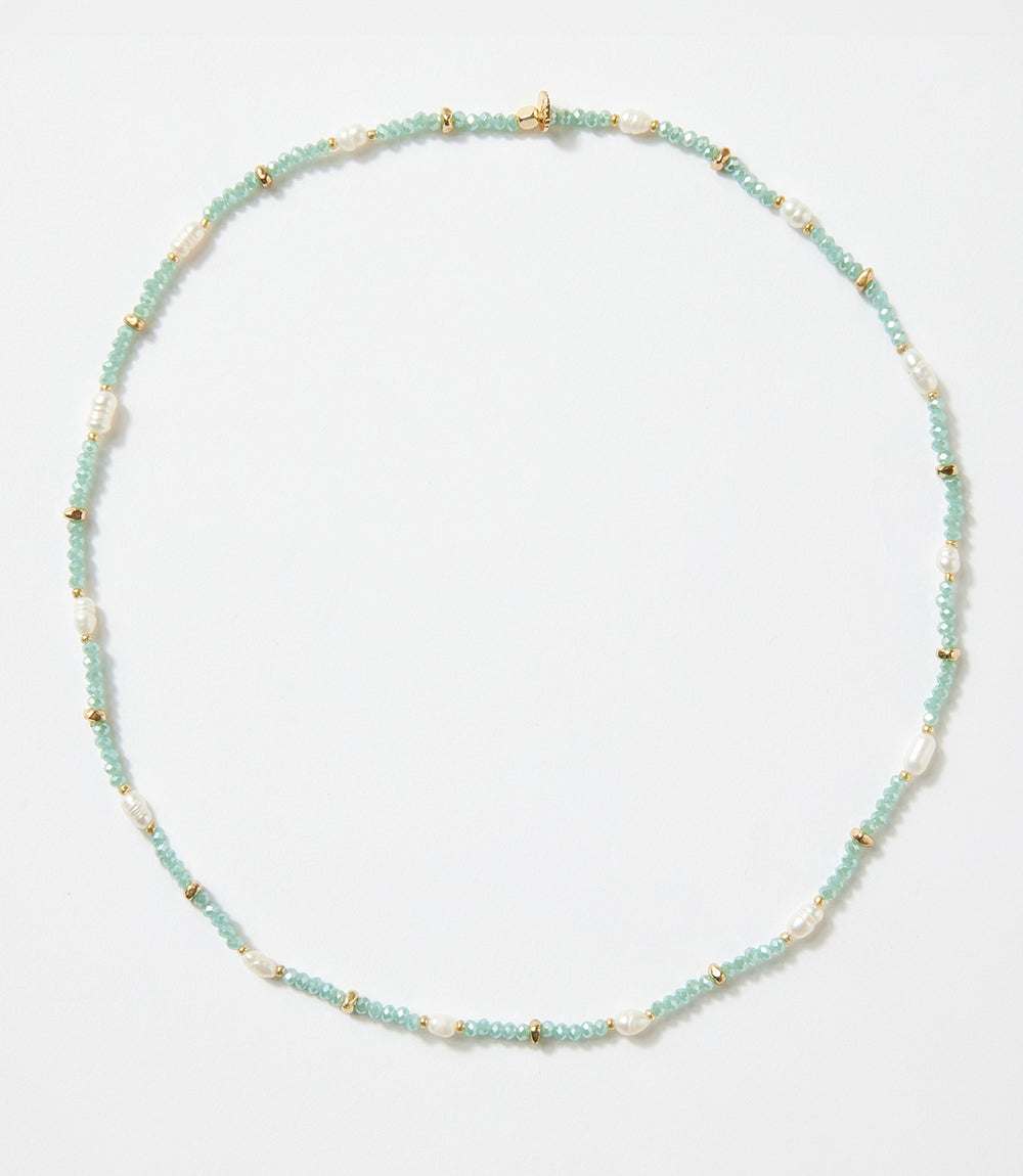 Beaded gemstone and pearl stretch bracelet that can be worn as a triple-wrap bracelet or necklace with metal and crystal bead accents.