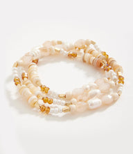 Pearl and gemstone beaded bracelet with crystals and metal beads, designed to wear wrapped twice or as a necklace.