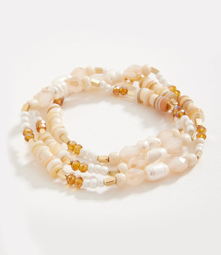 Pearl and gemstone beaded bracelet with crystals and metal beads, designed to wear wrapped twice or as a necklace.