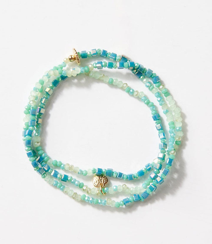 Crystal beaded stretch bracelet in blue and green tones with gold accents, wearable as bracelet or necklace.