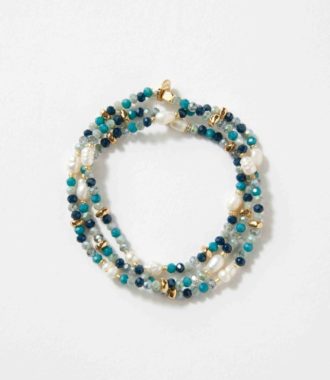 Beaded gemstone and pearl stretch bracelet with mixed blue and gold beads on white background