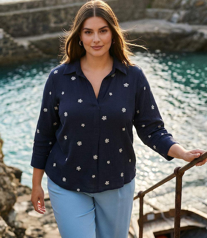 Plus size navy embroidered ruched sleeve shirt with floral detail and henley neckline