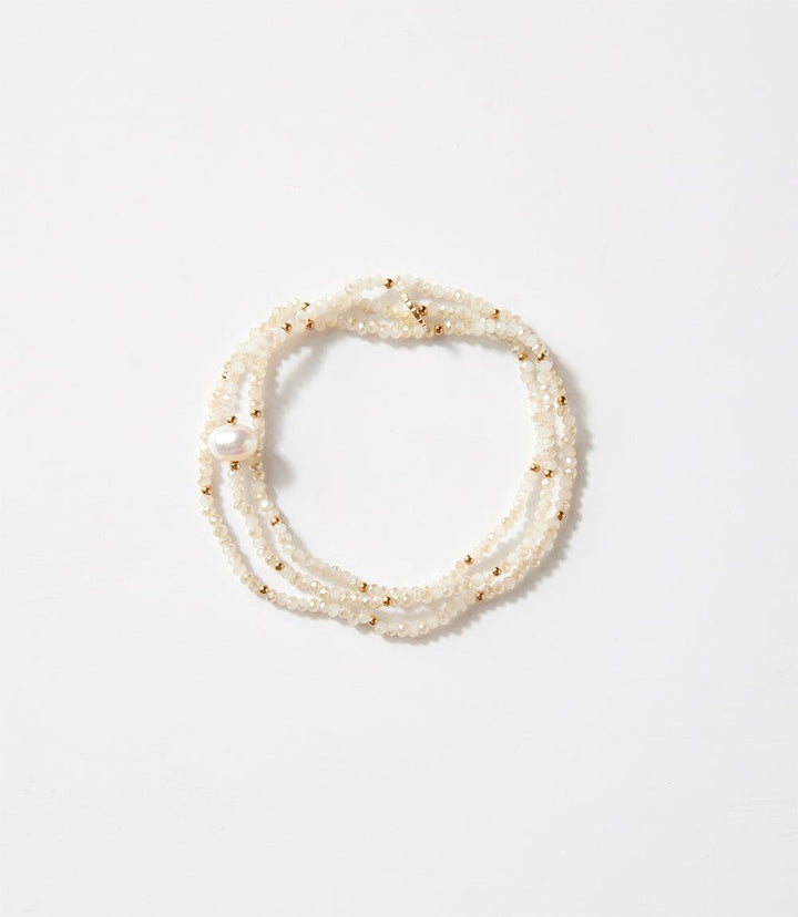 Crystal bead stretch bracelet with pearl and metal bead accents, versatile design for wrist or necklace wear