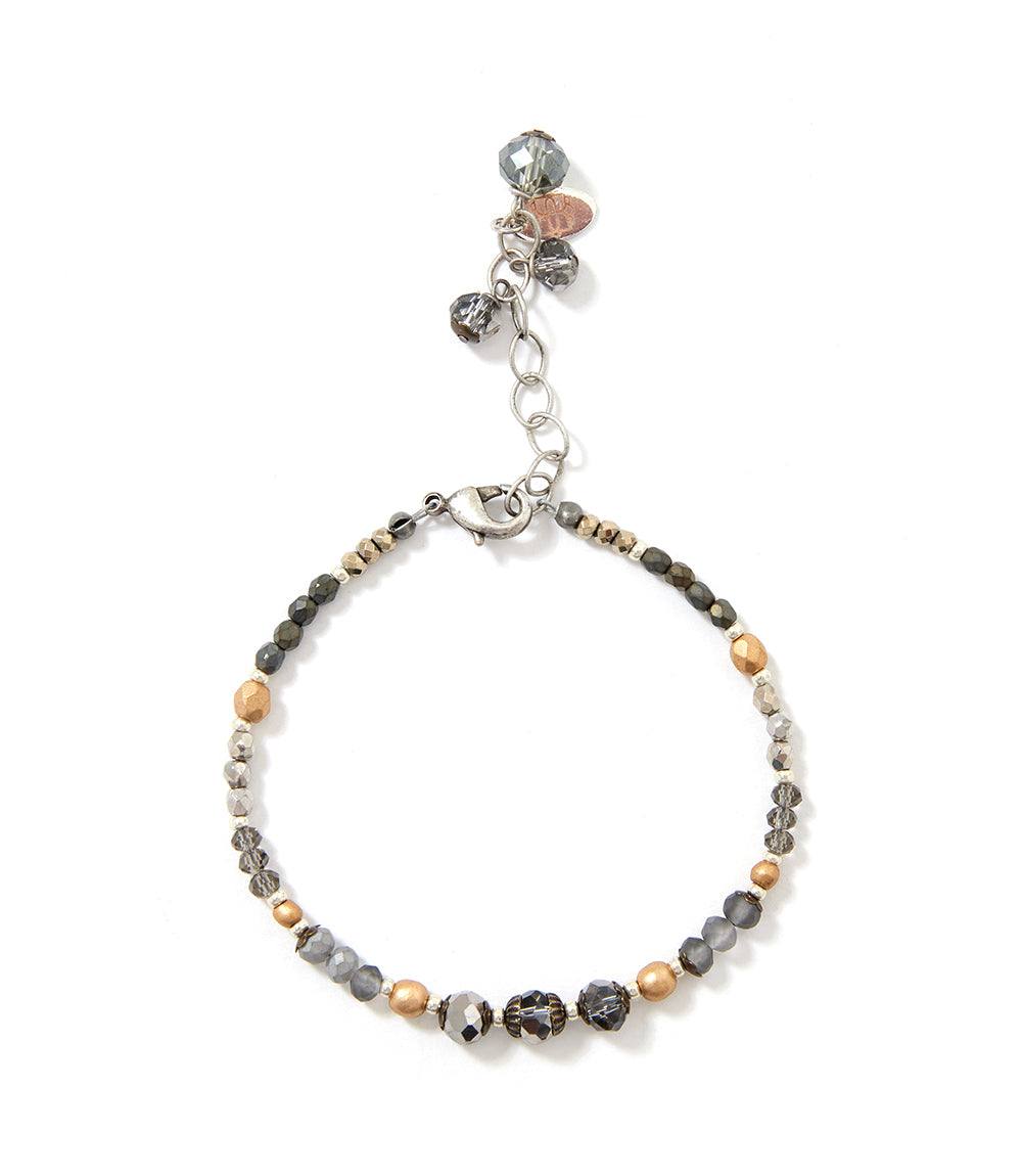 Elegant crystal and gemstone bracelet with silver and gold tones, featuring natural gemstones and adjustable clasp.