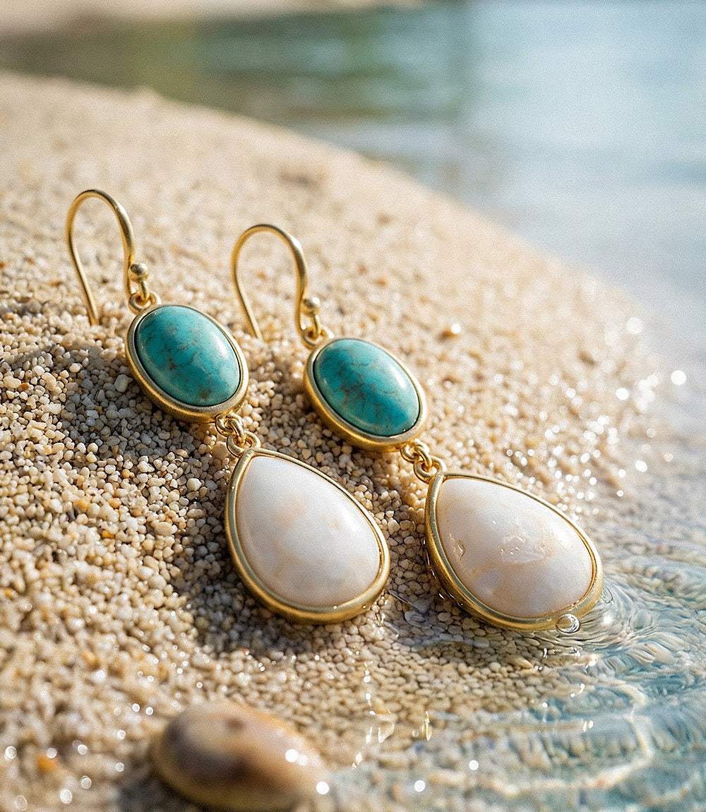 Turquoise and pearl teardrop earrings in matte gold setting with delicate turquoise stones and luminous pearl drops