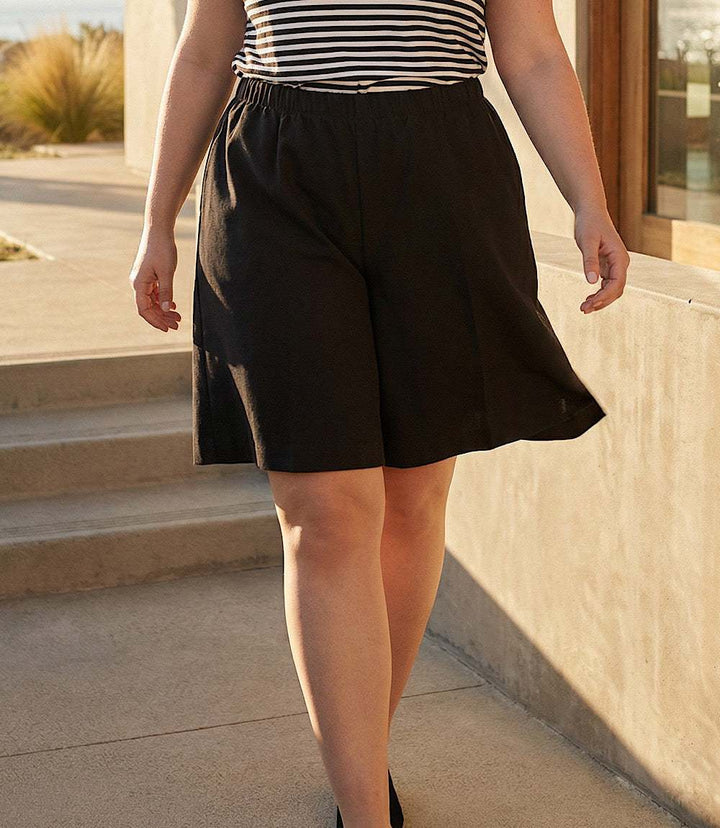 Plus size A-line shorts made of double stretch twill with elastic waistband and high rise design