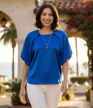 Elegant puff sleeve satin top with short raglan sleeves and back zipper closure