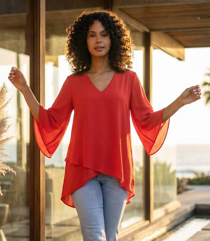 Elegant Bracelet Sleeve Asymmetric Top with layered hem and flare sleeves in silky crepe fabric