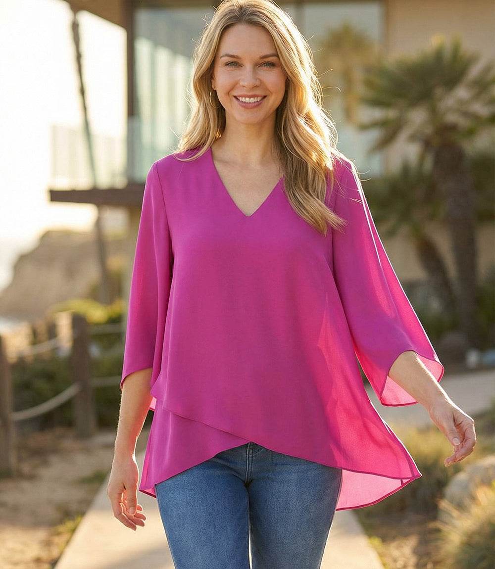 Bracelet Sleeve Asymmetric Top in silky crepe with V-neck, flare sleeves, and layered asymmetrical hem