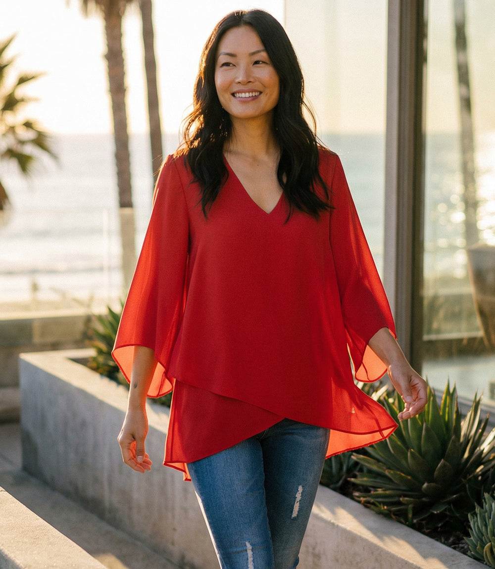 Bracelet Sleeve Asymmetric Top in silky crepe with flare sleeves and layered asymmetrical hem