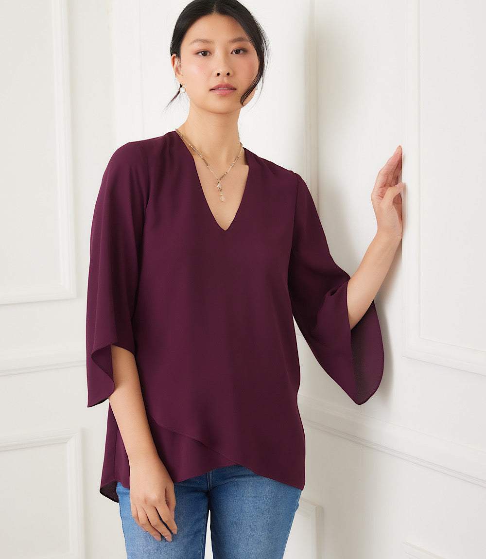 Petite size bracelet sleeve asymmetric top in deep plum with V-neck and layered hem made from silky crepe fabric