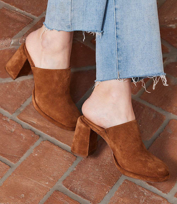 Seychelles Honor Suede brown leather high heel slip-on clogs with block heel and round toe worn with frayed hem jeans
