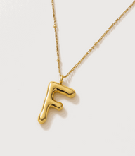 Gold bubble letter charm necklace with letter F in 16K gold over stainless steel