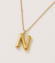 Gold bubble letter charm necklace with 16K gold-plated stainless steel chain and bold N pendant